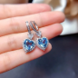 Preview: Charmantes Herz-Schmuckset mit meerblauem Saphir – Ring, Ohrringe und Halskette für Damen